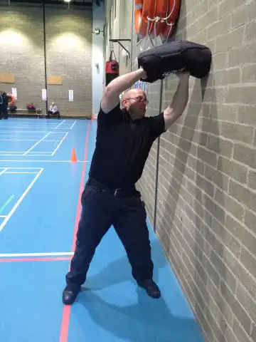 PC Daniel Sullivan, Specialist Trainer/ PTI at Bedfordshire Police puts a sandbag through its paces